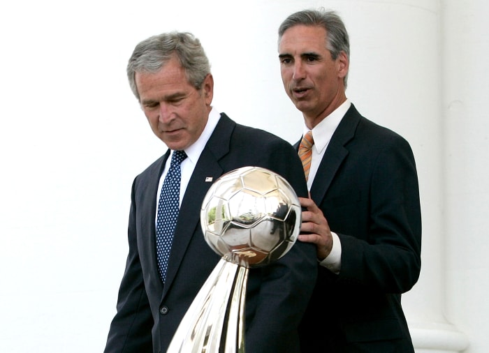 Luck and President George W. Bush with the Houston Dynamo’s 2006 MLS Cup trophy, one of two MLS titles the team won during Luck’s tenure as GM.